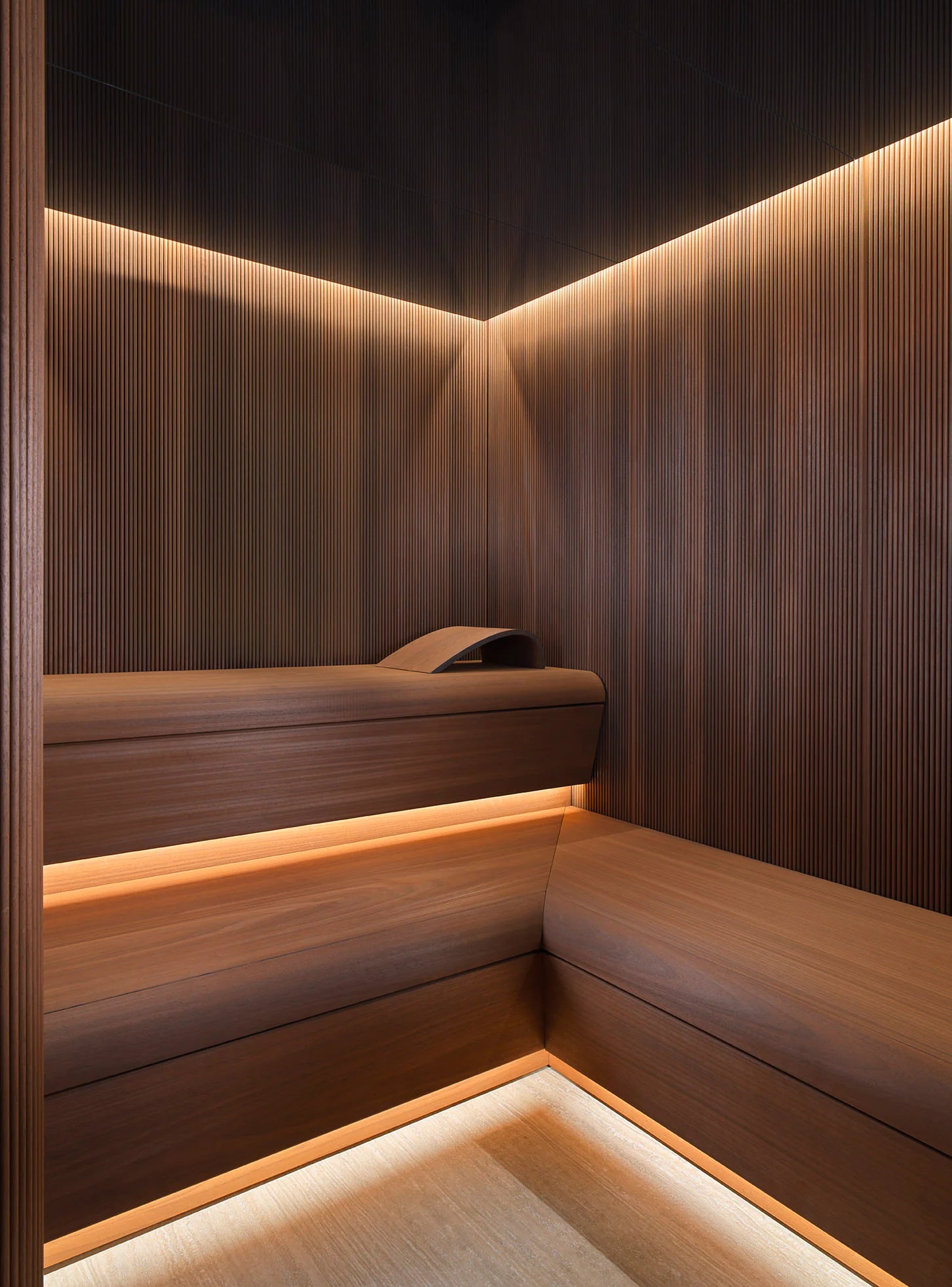 Corner bench configuration inside an INFINITY Sauna